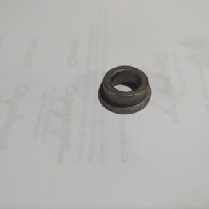 A small, round, black rubber grommet with a hole in the center.